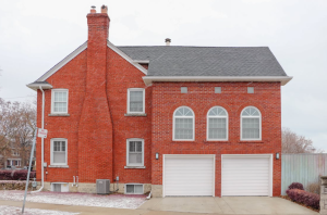 Masonry chimney in a brick house