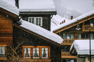 Snow falling on houses