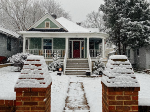 View of a property covered in snow