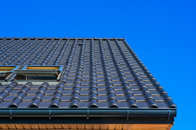 Vertical close-up shot of a black roof on a building