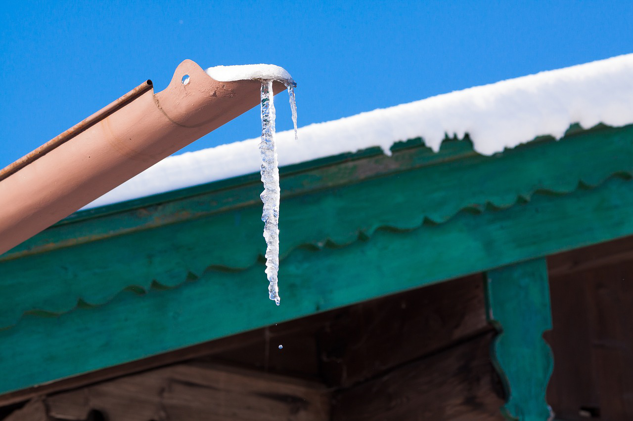 Icicles hanging from a gutter in winter.