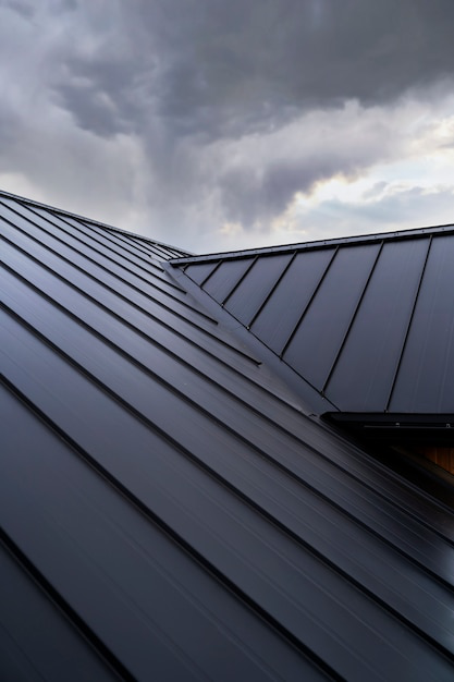 Low-angle view of a modern house roof with a sleek design.