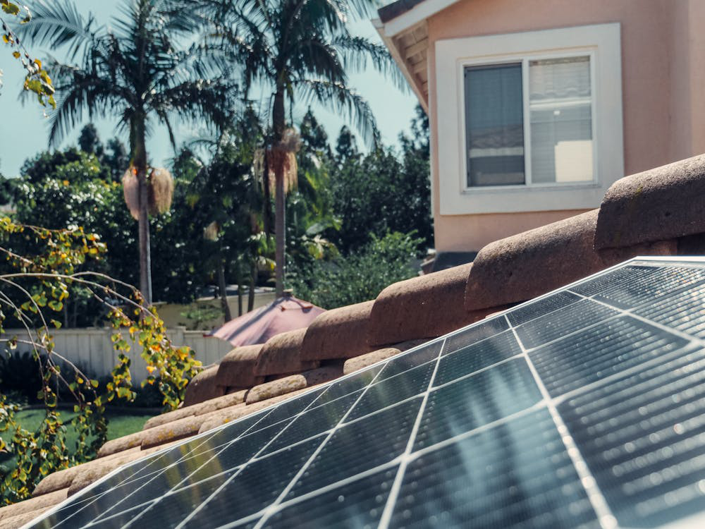 Solar panels installed on the roof of a house, promoting energy efficiency.