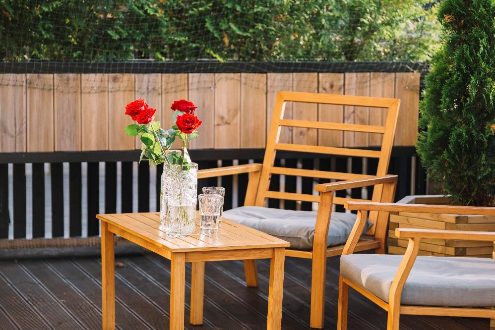 View of a table and chairs on a deck