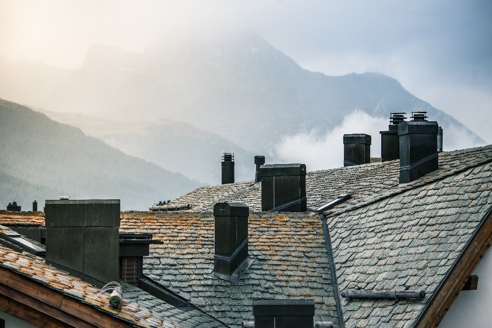 Rooftops of houses with chimneys