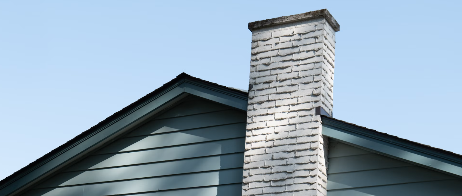 White painted masonry chimney