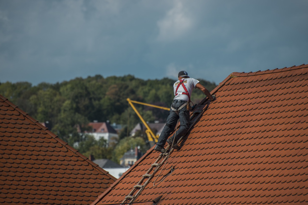 a roofing contractor at work
