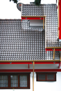 Clean and functional gutters on a house ensuring proper drainage and preventing water damage.