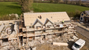 Professional roofing contractors working on a roof under construction, reinforcing durability and weather resistance.