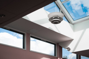 A bright, modern room with large skylights allowing natural sunlight to enhance the space.